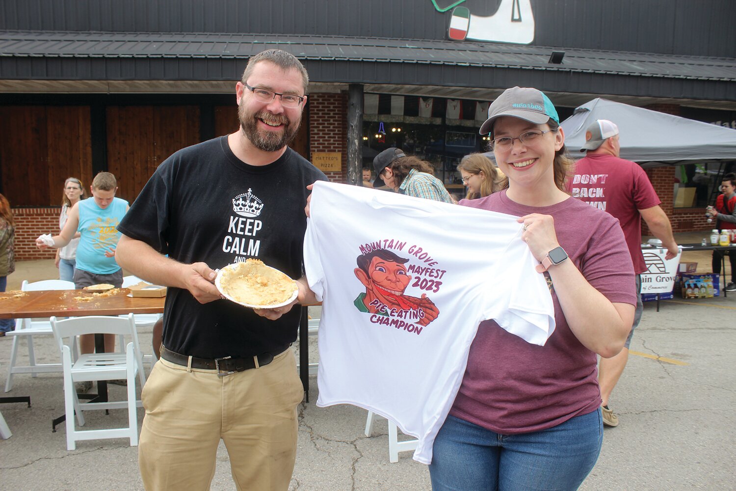 Mountain Grove Chamber of Commerce Executive Director Becca Coble, right, with the Mountain Grove Mayfest Pie Eating Contest winner Daniel Owen, of Mountain Grove.
